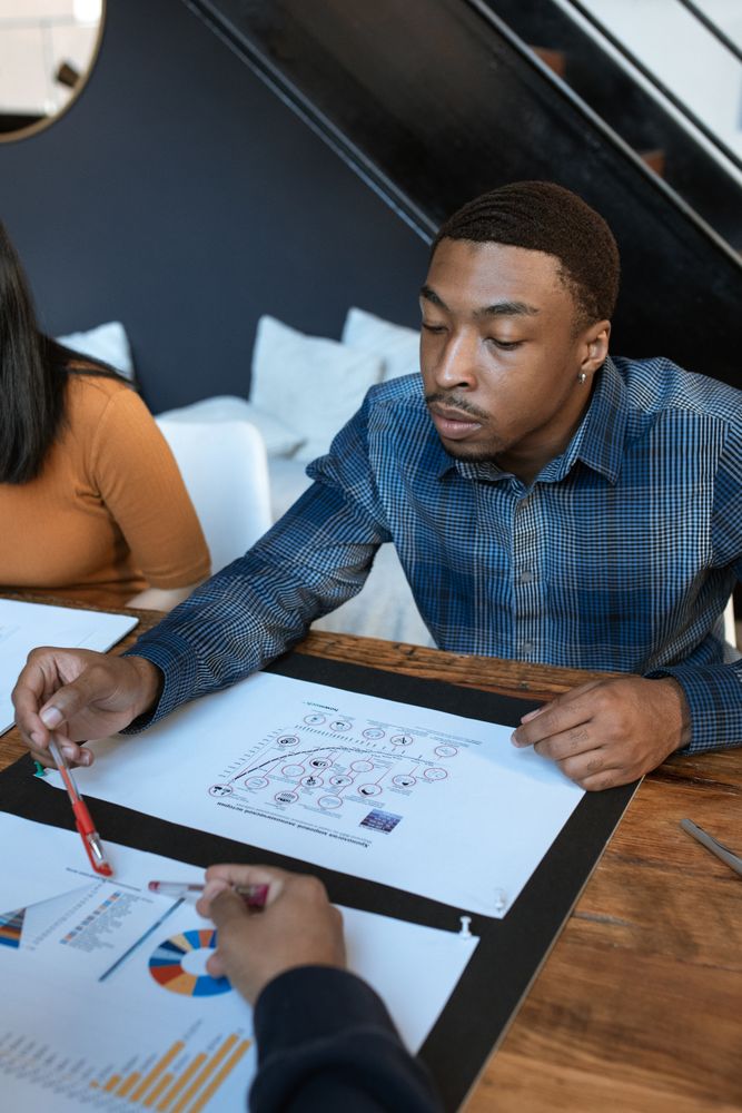 Professionals reviewing business analytics and decision data