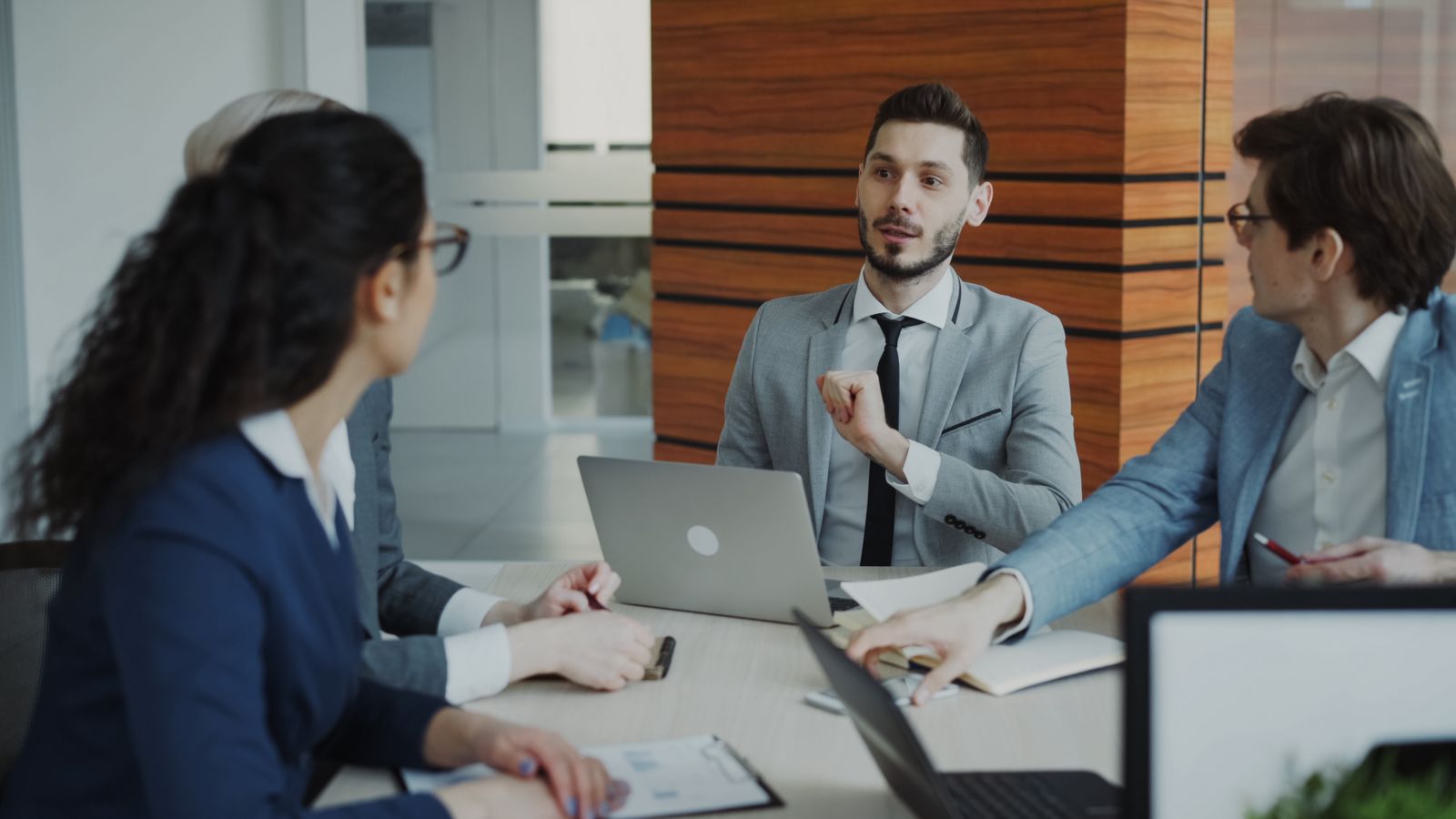 Business team discussing growth and scale in a modern office